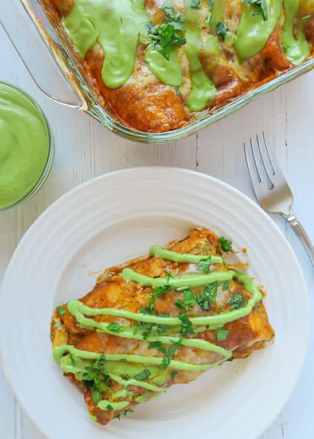 Overhead shot of the Baked Red Chicken Enchiladas (with Creamy Avocado Sauce Drizzle)