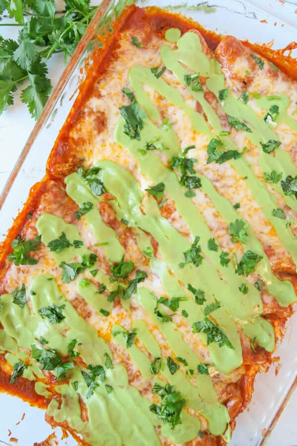 Baked Red Chicken Enchiladas (with Creamy Avocado Sauce Drizzle)