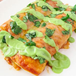 Easy Baked Red Chicken Enchiladas (with Creamy Avocado Sauce Drizzle)