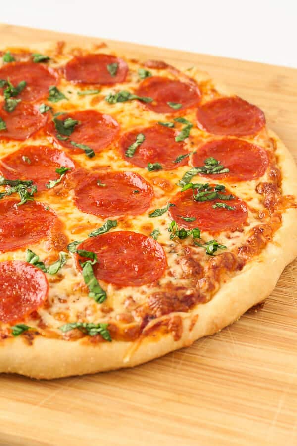 pepperoni pizza using the perfect thin crust pizza dough recipe