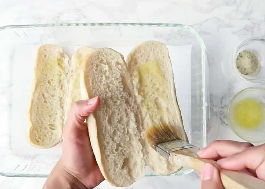 buttering bread for meatball subs